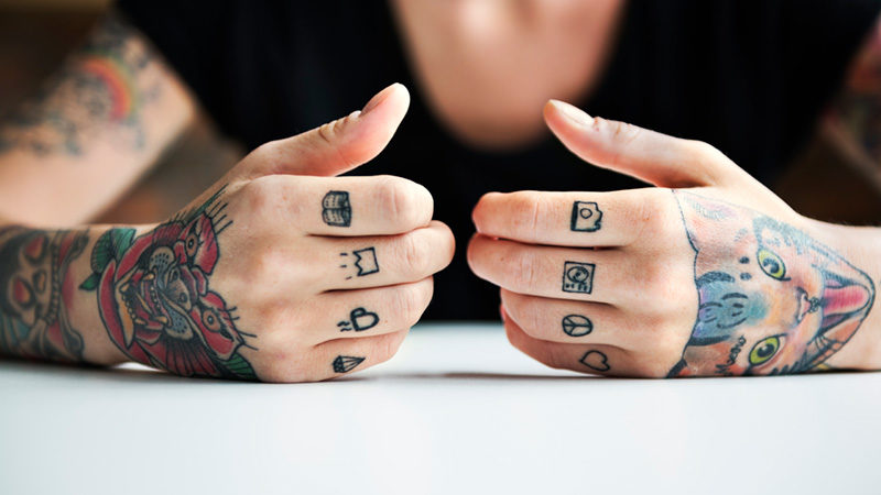 woman with Tattooed fingers